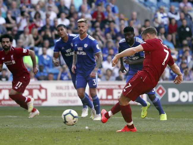 Liverpool's James Milner takes his kick from the penalty spot against Cardiff City.