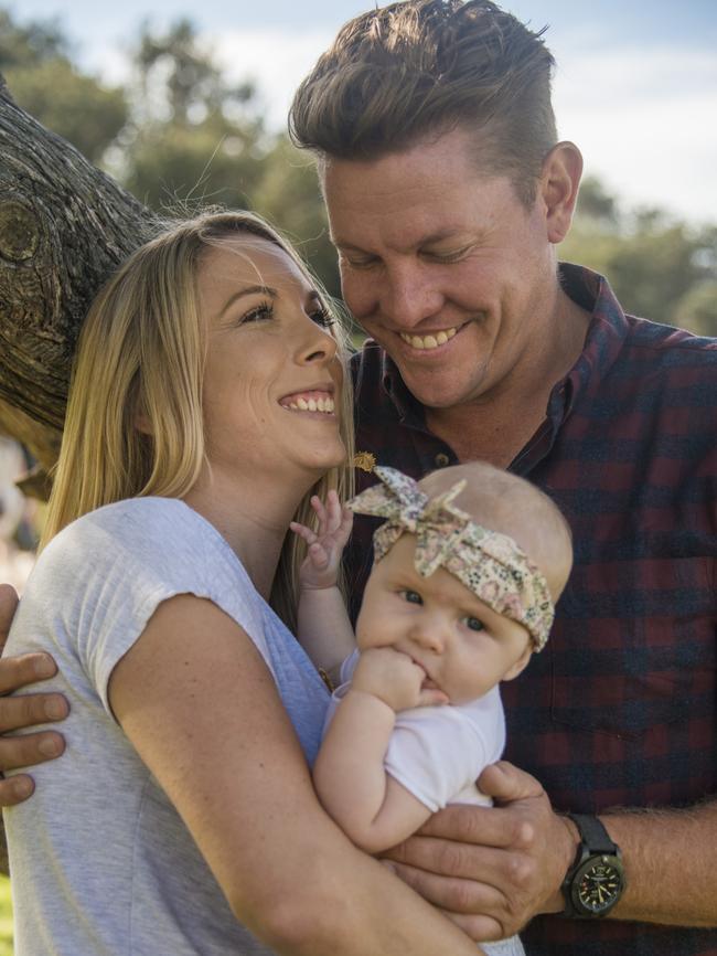 Mr Thomlinson with his partner Abby Anderson and daughter Isla.