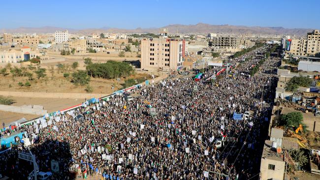 Yemenis wave flags and chant slogans during a march in solidarity with the people of Gaza. Picture: AFP