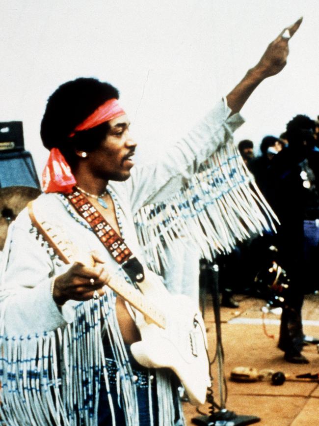 Jimi Hendrix saluting at Woodstock in 1969, Strat in hand. Picture: archive