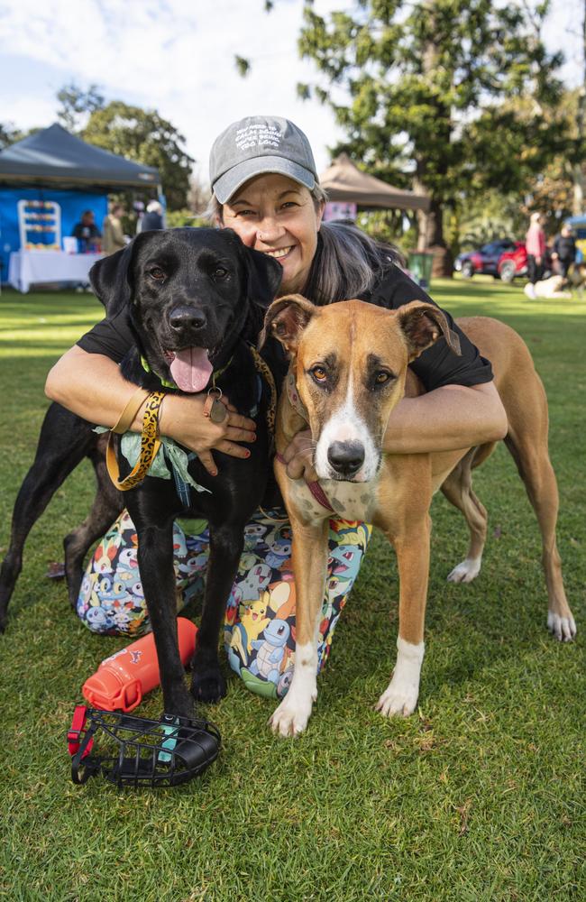 Jessica Bohan with Korra (left) and Coby before Toowoomba's Million Paws Walk at Queens Park, Friday, May 24, 2024. Picture: Kevin Farmer