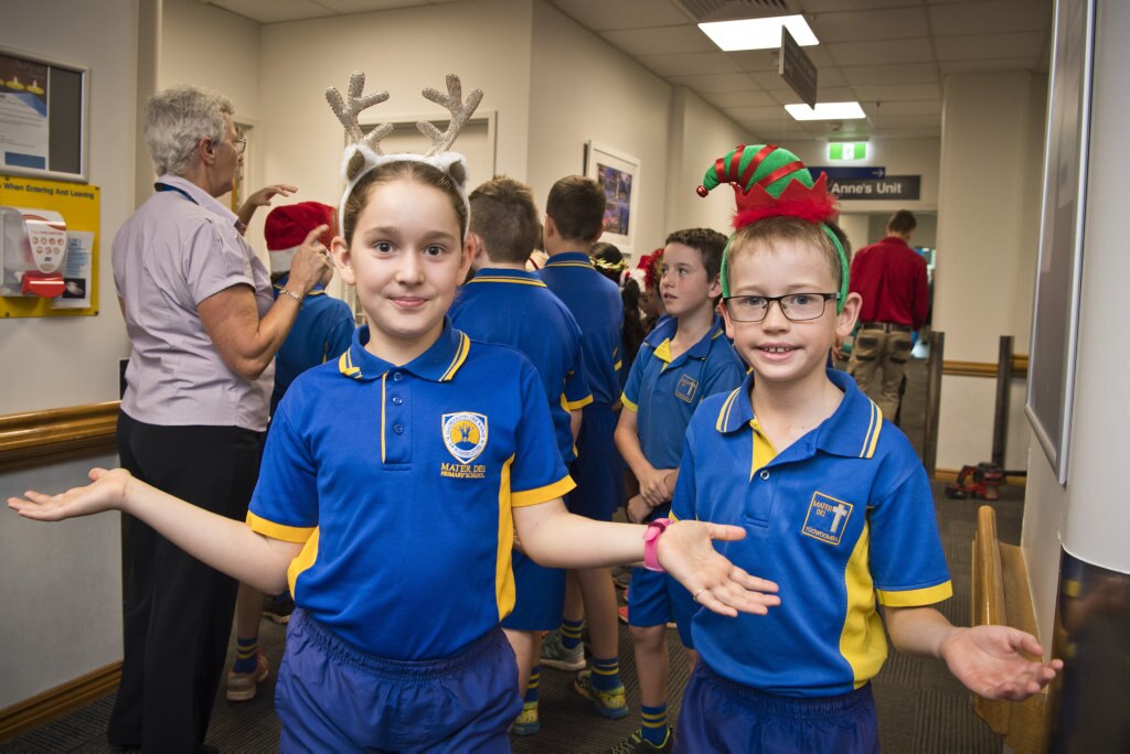 Alexia Davey and Lachlan McConnel as Mater Dei Primary School Yr 4 students sing Christmas carols in the wards of St Vincent's Private Hospital, Friday, November 29, 2019. Picture: Kevin Farmer