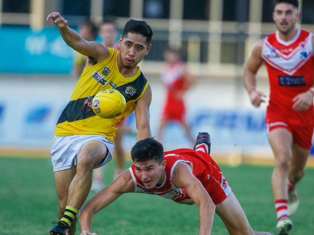 Tigers Ryan Mu on the run for the ball. Picture: Glenn Campbell