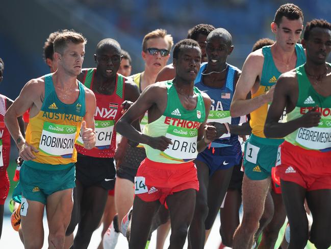 Australia's Brett Robinson and Patrick Tiernan in the Men's 5000m Round 1during the Athletics on Day 12 of the Rio 2016 Olympic Games. Picture: Phil Hillyard
