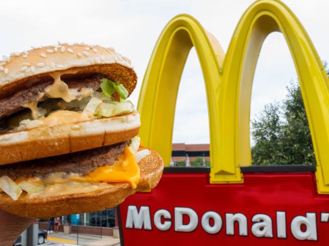 (FILES) This file photo taken on August 10, 2015 shows a McDonald's Big Mac, held up near the golden arches at a McDonalds's in Centreville, Virginia.      McDonald's reported higher second-quarter profits July 25, 2017 behind strong comparable sales in key markets, including the United States, where the chain has launched new products and focused on customer service.  Net income for the quarter ending June 30 was $1.4 billion, up 28 percent from the year-ago period in results that easily topped analyst expectations. Shares rose sharply in pre-market trading. / AFP PHOTO / Paul J. RICHARDS