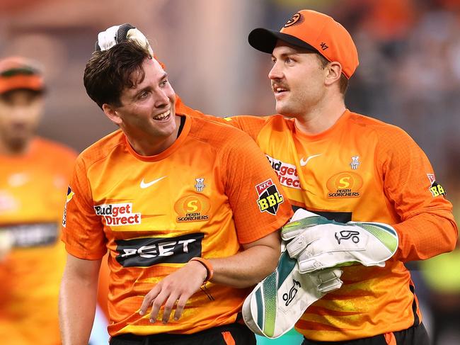 PERTH, AUSTRALIA - DECEMBER 17: Jhye Richardson of the Scorchers celebrates the wicket of Jackson Bird of the Sixers with Josh Inglis during the Men's Big Bash League match between the Perth Scorchers and the Sydney Sixers at Optus Stadium, on December 17, 2022, in Perth, Australia. (Photo by Paul Kane/Getty Images)