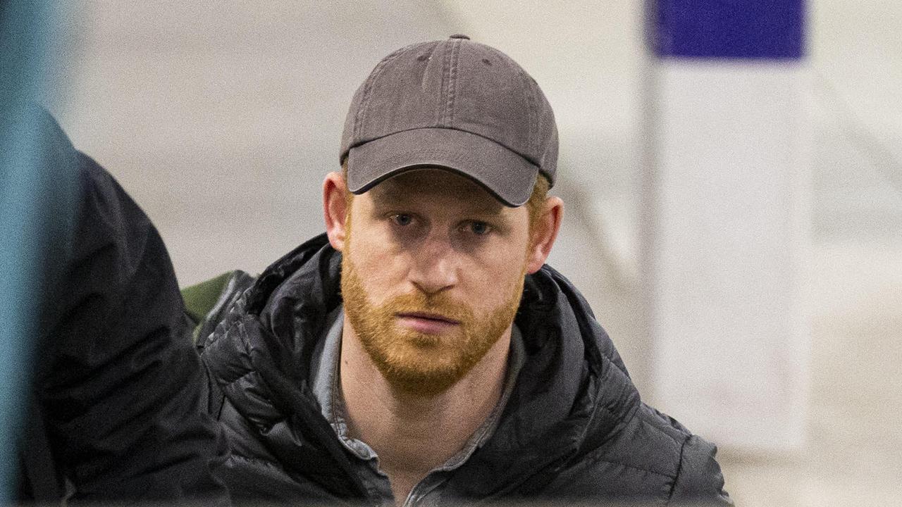 Harry looked exhausted as he trudged through Edinburgh’s Waverley Station. Picture: Splash News.