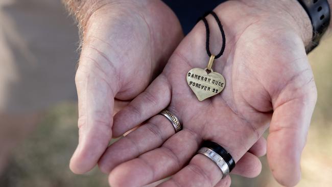 Chris Duce with the medallion he wears around his neck. Picture: Luke Marsden