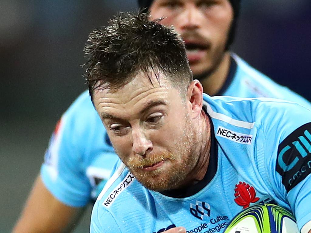 SYDNEY, AUSTRALIA - APRIL 20: Jed Holloway of the Waratahs is tackled during the round 10 Super Rugby match between the Waratahs and the Melbourne Rebels at the Sydney Cricket Ground on April 20, 2019 in Sydney, Australia. (Photo by Cameron Spencer/Getty Images)