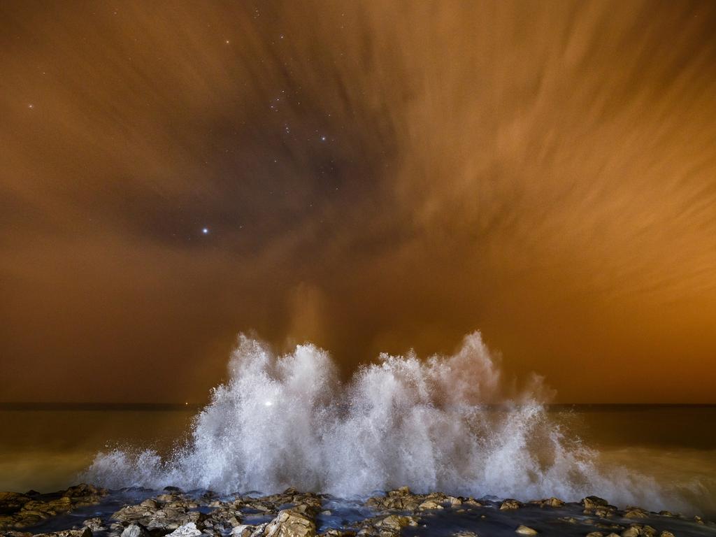 La Ola. Photographer: Felipe Tomas Jiménez Ordóñez Year: 2018 “The photo was taken on the students’ beach, in Villajoyosa, Alicante, Spain, during a stormy night where the wind formed waves of up to five meters. It is a part of the coast characterized by cliffs and stone beaches. The sky is yellowed by the luminous contamination of the lampposts, and clouds leave trails from the long exposure of 30 seconds. The photograph was taken on a camera with a 14mm lens, a tripod and flash.” Copyright: © Felipe Tomas Jiménez Ordóñez, Spain, Open, Landscape &amp; Nature, 2018 Sony World Photography Awards