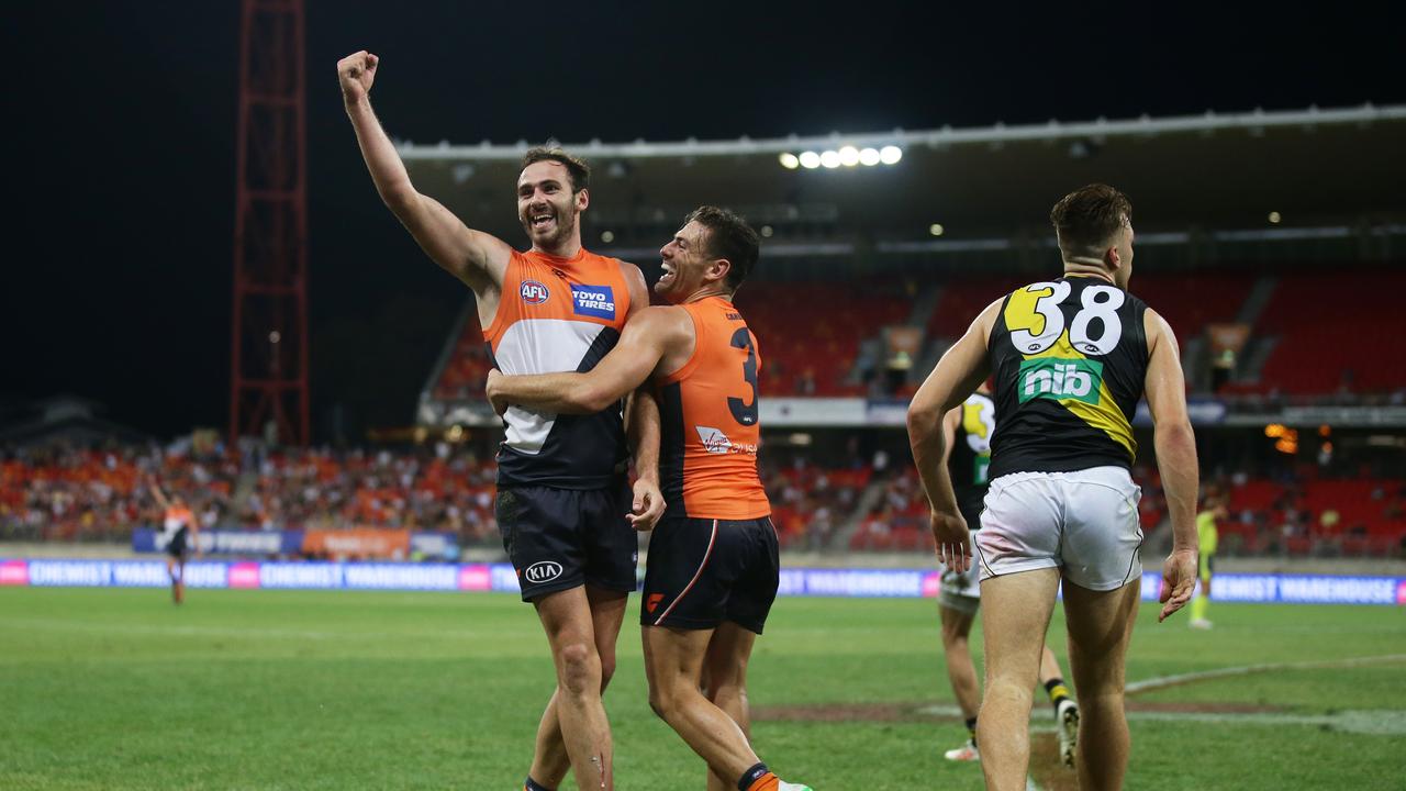 Jeremy Finlayson of the Giants celebrates with Stephen Coniglio.