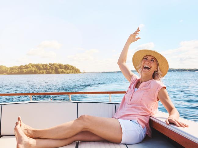 Shot of a mature woman enjoying a relaxing boat ride