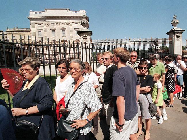 Long lines form outside Buckingham Palace as the annual summer opening of the Palace begins in August. Last August, a man broke into Palace grounds. Picture: AFP