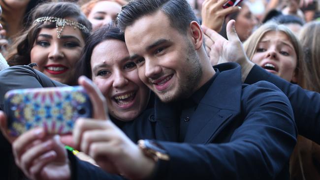 SYDNEY, AUSTRALIA - NOVEMBER 26:  Liam Payne from One Direction takes a selfie with fans at the 28th Annual ARIA Awards 2014 at the Star on November 26, 2014 in Sydney, Australia.  (Photo by Cameron Spencer/Getty Images)