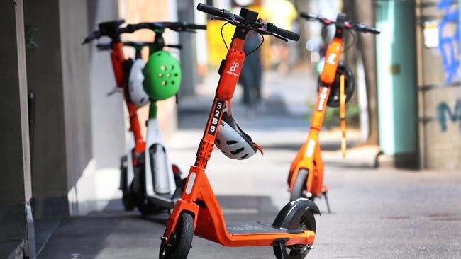 E-scooters parked randomly over the footpath on City road Southbank. Picture: David Caird