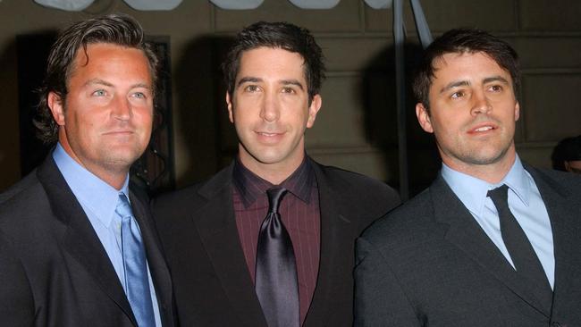 Perry with Friends co-stars David Schwimmer and Matt Leblanc. Picture: Chris Delmas / AFP