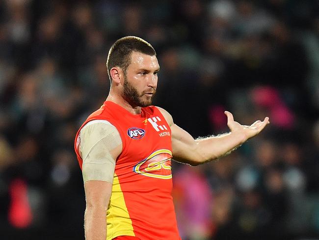 ADELAIDE, AUSTRALIA - AUGUST 26: Mitch Hallahan of the Suns kicks the ball during the round 23 AFL match between the Port Adelaide Power and the Gold Coast Suns at Adelaide Oval on August 26, 2017 in Adelaide, Australia.  (Photo by Daniel Kalisz/Getty Images)