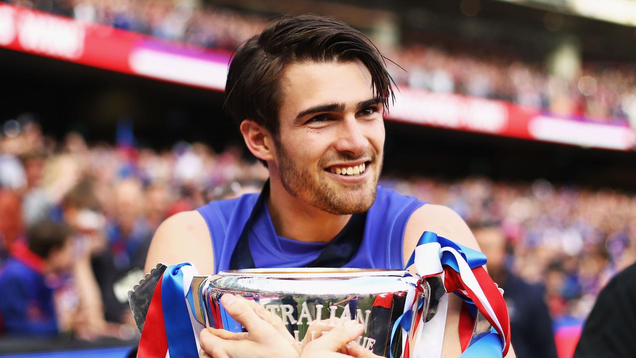 MELBOURNE, AUSTRALIA - OCTOBER 01: Easton Wood of the Bulldogs celebrates with the Premiership Cup after the 2016 Toyota AFL Grand Final match between the Sydney Swans and the Western Bulldogs at the Melbourne Cricket Ground on October 01, 2016 in Melbourne, Australia. (Photo by Ryan Pierse/AFL Media/Getty Images)