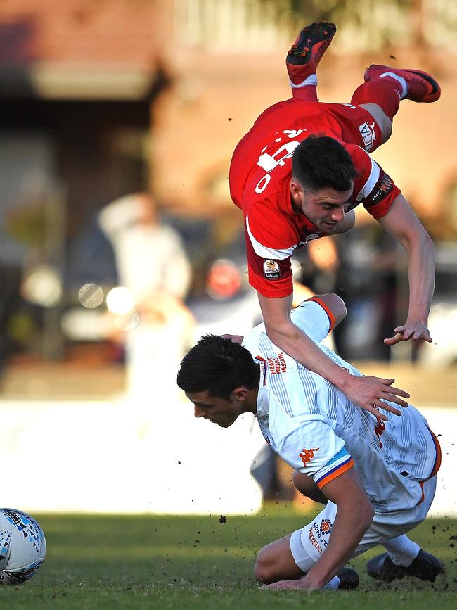 Marc Marino of Campbelltown City is fouled by Matija Simic of Lions FC. Picture: Mark Brake/Getty Images