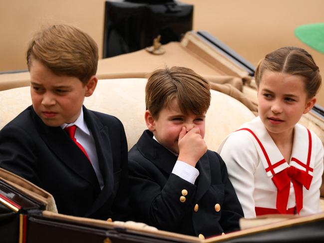 Prince George of Wales, Prince Louis of Wales and Princess Charlotte arrive in a horse-drawn carriage on Horse Guards Parade for the King's Birthday Parade. Picture: Daniel Leal / AFP