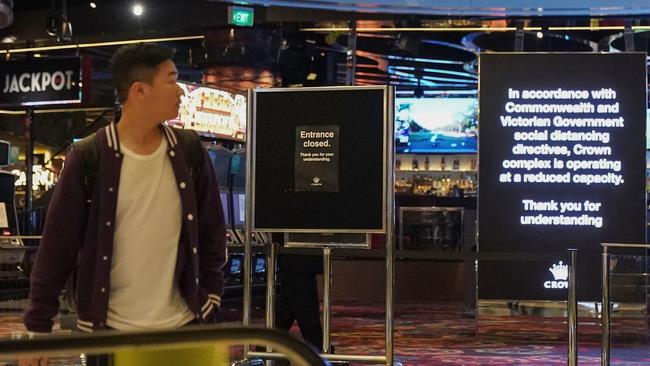 A man looks on at a closed entrance inside Melbourne’s Crown casino. Picture: AAP Image/Scott Barbour