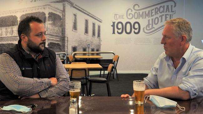 Josh Lewis and Troy Bell celebrating at The Commercial Hotel after successfully lobbying the government to expand the eligibility criteria for business grant funding. Picture: Kate Hill