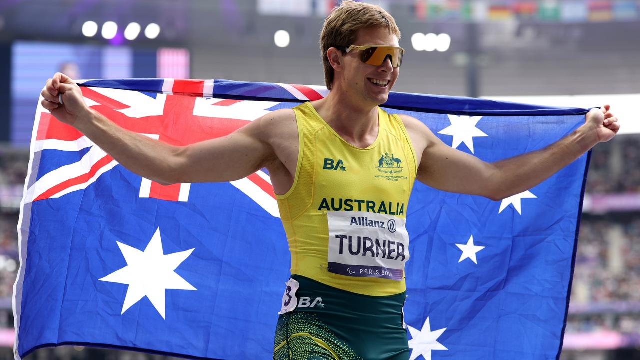 Gold medallists and flag bearers Lauren Parker and James Turner each won two golds at the Games, Turner’s second in the men's 100m T36 final on day 10. Picture: Ezra Shaw/Getty Images