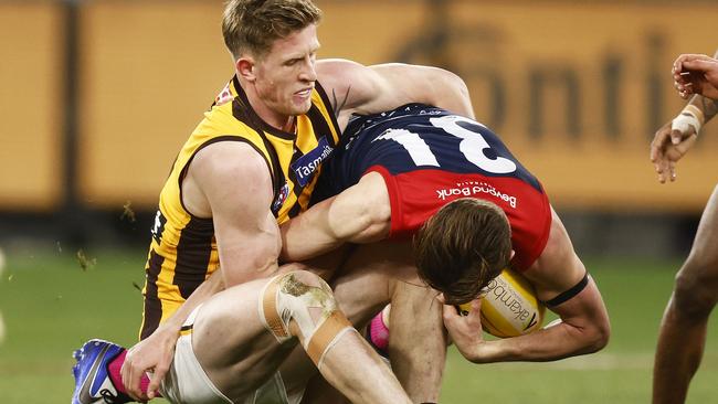 Bayley Fritsch is tackled by Sam Frost during the exciting draw at the MCG. Picture: AFL Photos/via Getty Images