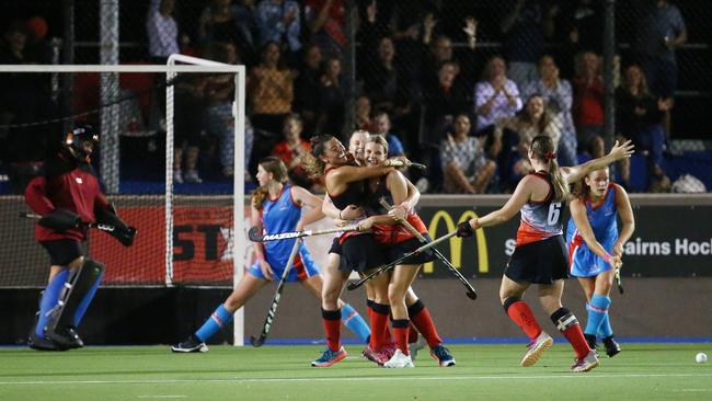 Souths' Sarah Cochran celebrates with teammates after getting a shot past Saints goal keeper Kristen Fixter in the final seconds and winning the Cairns Hockey Association Women's grand final match between South Cairns and the Cairns Saints. Picture: Brendan Radke