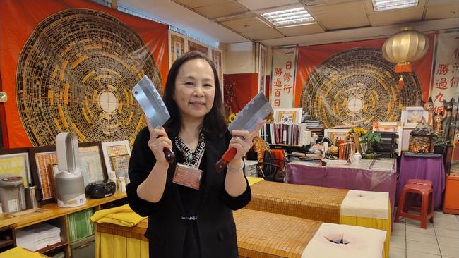 An eager practitioner of the cleaver massage in Taipei City Mall, Taiwan. Picture: Fiona Harari