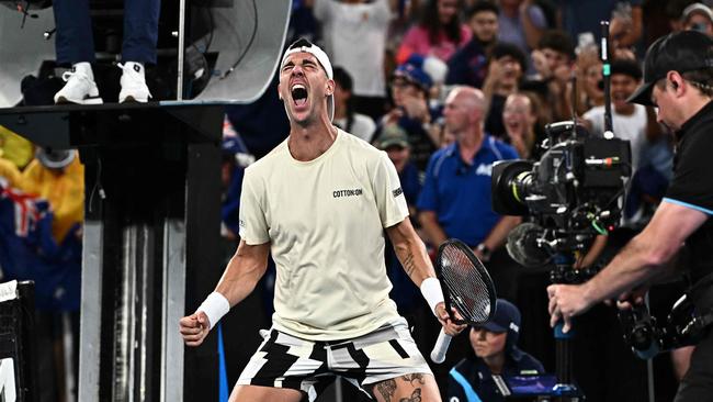 Australia's Thanasi Kokkinakis celebrates after victory against Austria's Sebastian Ofner during their men's singles match on day three of the Australian Open tennis tournament in Melbourne on January 16, 2024. (Photo by Lillian SUWANRUMPHA / AFP) / -- IMAGE RESTRICTED TO EDITORIAL USE - STRICTLY NO COMMERCIAL USE --