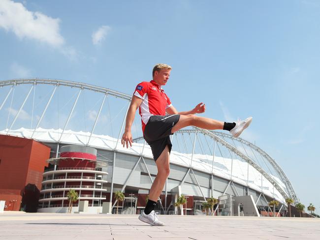 Isaac Heeney has a kick outside the Khalifa International Stadium, the main venue in the Aspire Zone for the 2022 Football World Cup in Qatar. Picture: Phil Hillyard