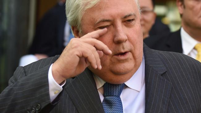 PUP leader Clive Palmer (C) and PUP Senator Glenn Lazarus (R) arrive for a press conference at Parliament House ahead of the Intergeneratiolal Report to be released on Thursday, Canberra, Wednesday, March 4, 2015. (AAP Image/Mick Tsikas) NO ARCHIVING