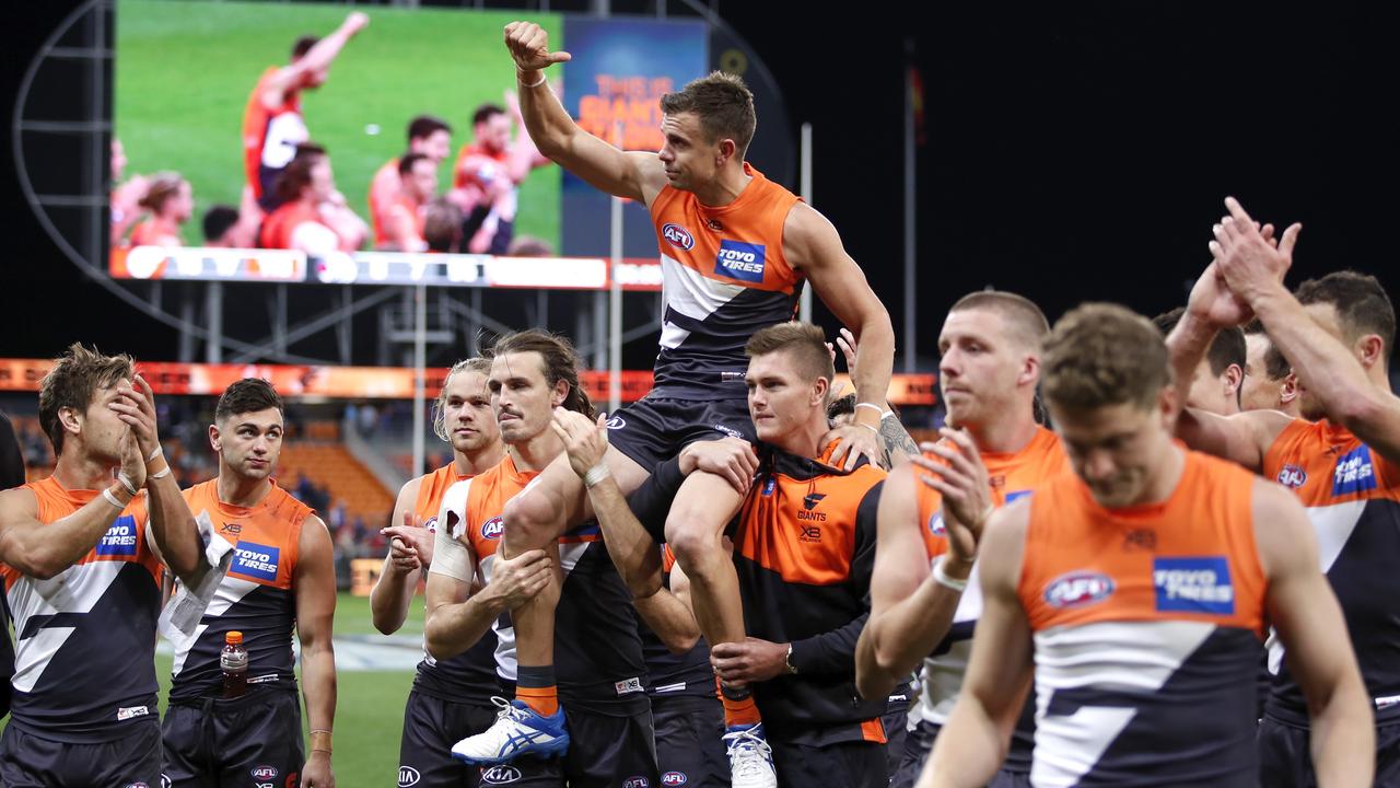 Brett Deledio of the Giants was chaired off Giants Stadium by teammates Phil Davis and Adam Tomlinson.