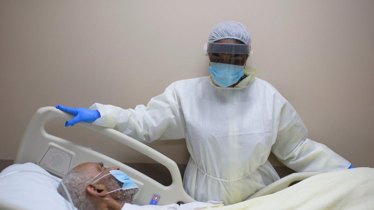 A healthcare worker tends to a patient in the COVID-19 Unit at United Memorial Medical Center in Houston where ICU beds near capacity. Picture: Mark Felix