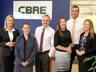 WINNING WAYS: Kate Pascoe, left, and CBRE team members Rachael Mokoroa (assistant property manager), Rem Rafter (managing director), Tori Dodd (property manager), Ryan Parry (manager) and Eboney Shedden (property manager).