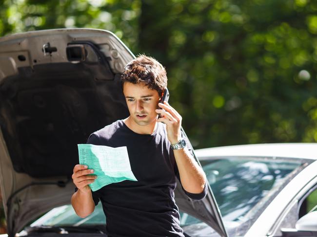 MOTORING: CAR BREAKDOWN Picture: istock Handsome young man calling for assistance with his car broken down by the roadside