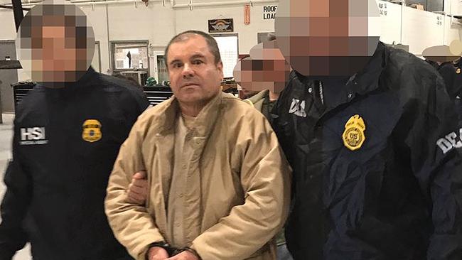 Joaquin Guzman Loera aka "El Chapo" Guzman (C) escorted in Ciudad Juarez by the Mexican police as he is extradited to the United States. Picture:  AFP