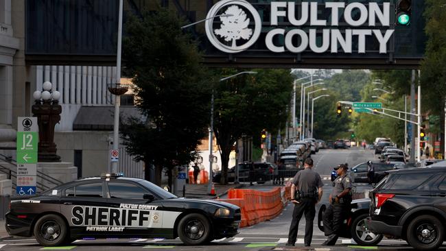 Sheriff officers throw a cordon around the Fulton County Courthouse in Atlanta with a grand jury decision expected on Donald Trump. Picture: AFP