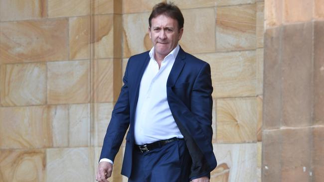 Salvatore ‘Sam’ Sgherza leaves the Adelaide Magistrate Court on Monday — the court heard he had agreed to plead guilty on four counts of acting illegally before his bankruptcy in 2012. Picture: Tricia Watkinson