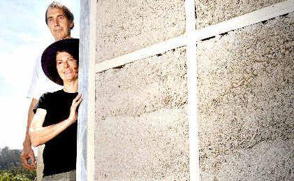 Alternative builders Patricia Schmidt and Graham Sippo of Larnook using secret hemp mixture to fill the wall cavities of their home before rendering it to improve its liveability. Picture: Jay Cronan