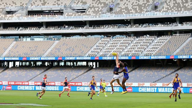 West Coast vs Melbourne at an empty Optus Stadium in Perth in the last AFL game for the foreseeable future. Footy will never be the same again. Picture: AAP