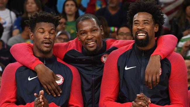 (L-R) Gold medallists USA's forward Jimmy Butler, USA's guard Kevin Durant and USA's centre DeAndre Jordan stand on the podium after the final of the Men's basketball competition at the Carioca Arena 1 in Rio de Janeiro on August 21, 2016 during the Rio 2016 Olympic Games. / AFP PHOTO / Mark RALSTON