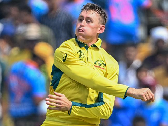 Australia's Marnus Labuschagne throws the ball to run out Bangladesh's Najmul Hossain Shanto during the 2023 ICC Men's Cricket World Cup one-day international (ODI) match between Australia and Bangladesh at the Maharashtra Cricket Association Stadium in Pune on November 11, 2023. (Photo by Punit PARANJPE / AFP) / -- IMAGE RESTRICTED TO EDITORIAL USE - STRICTLY NO COMMERCIAL USE --