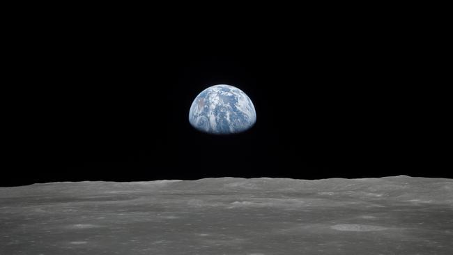 A view of Earth rising over the moon's horizon. Picture: AFP