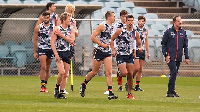 ADELAIDE, AUSTRALIA - JUNE 23: (L-R) Rory Sloane of the Crows, Curly Hampton of the Crows and Adelaide Crows Senior Coach Don Pyke look on during a training session prior to a press conference at AAMI Stadium on June 23, 2018 in Adelaide, Australia.  (Photo by Daniel Kalisz/Getty Images)