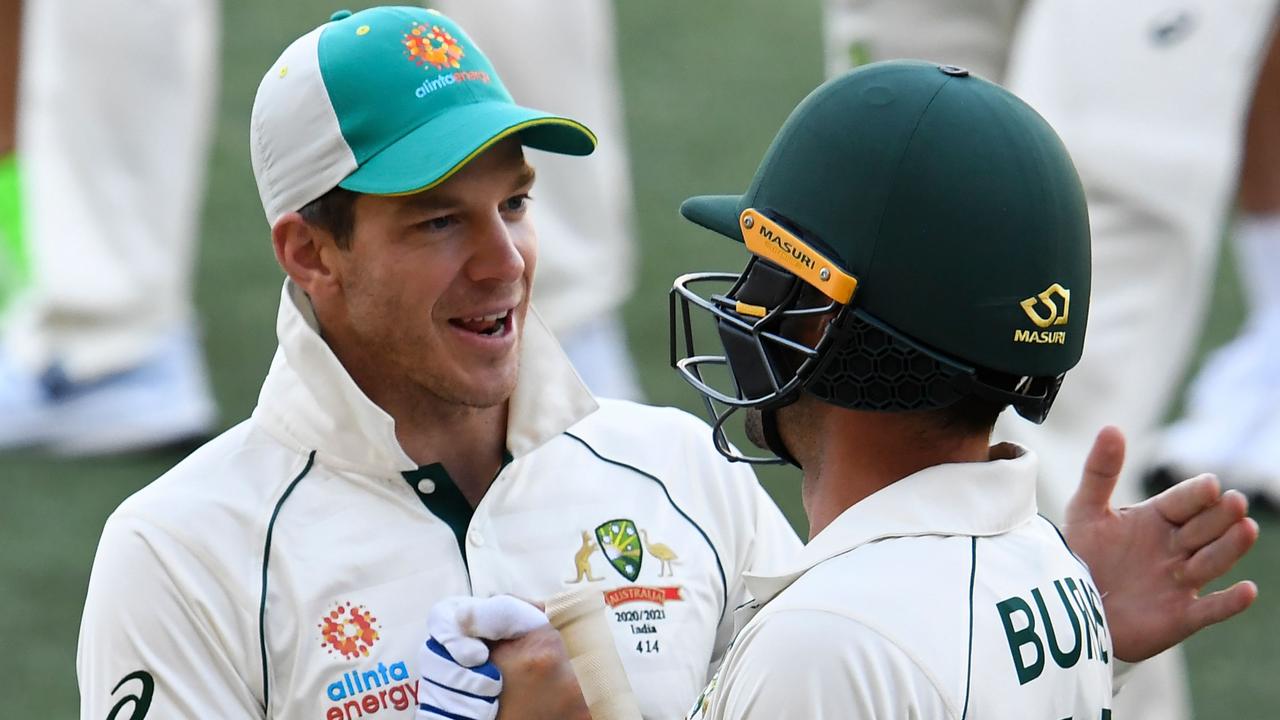 Australia's captain Tim Paine congratulates Joe Burns. Picture: AFP