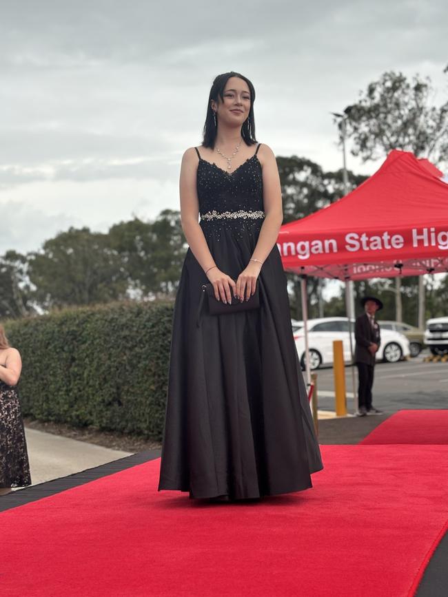 The students of Urangan State High School arriving at their formal.