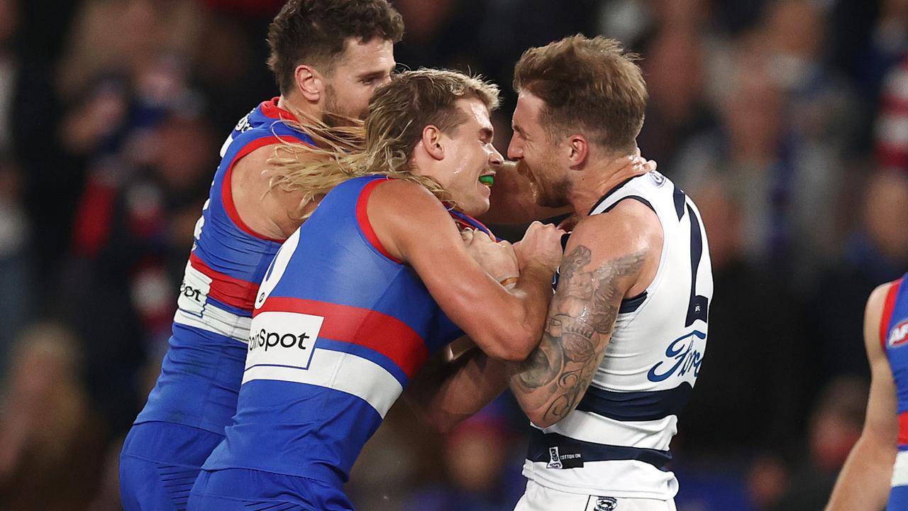 Bailey Smith and Zach Tuohy of the Cats tussle after the siren. Picture: Michael Klein