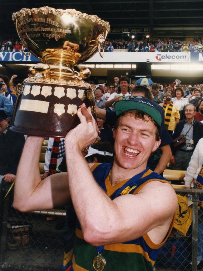 Eagles captain Peter Schwarz holds the Thomas Seymour Hill trophy aloft in 1993. Picture: Neon Martin